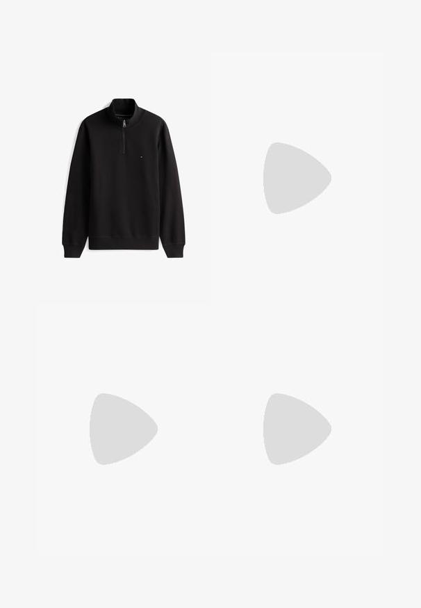 Must pikkade varrukatega pullover poollukuga kraega ja väike punane, valge ning sinine logo vasakul rinnal.; Valge pikkade varrukatega polo särk, mis on valmistatud puuvillast, omab teravat kraed, kahest nupust koosnevat rinnapaneeli ja väikest logo rinnal. Krae sees oranž toon.; Beežid, kerged puuvillased püksid sirge sääre kujundusega, millel on nööbilukuga kinnitamine ja kerge tekstuur. Lacoste logo vöökohal.; Must Lacoste madala säärega toss, millel on paeltega disain, perforatsioonid ja krokodilli logo küljel, nähtav välisküljelt.