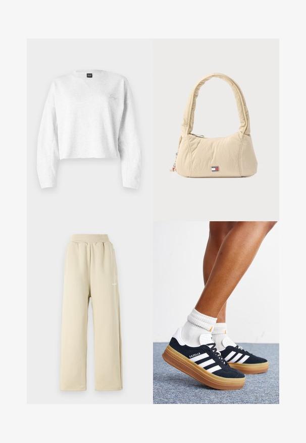 Gecropptes graues Sweatshirt aus weichem Material; mit V-Ausschnitt, langen Ärmeln und einem kleinen gestickten Logo auf der linken Brust.; Beige weit geschnittene Sweatpants aus weichem Stoff, mit einem elastischen Bund, seitlichen Taschen und einem kleinen bestickten Logodetail.; Beine mit weißen Socken und schwarzen Adidas Gazelle Sneakers mit weißen Streifen und dicken braunen Sohlen auf einem grauen Teppichboden.; Schultertasche in Cremefarben aus weichem, gestepptem Stoff, mit einem geschwungenen Griff und einem Logo-Patch. Reißverschluss mit zusätzlichem Charme-Detail.