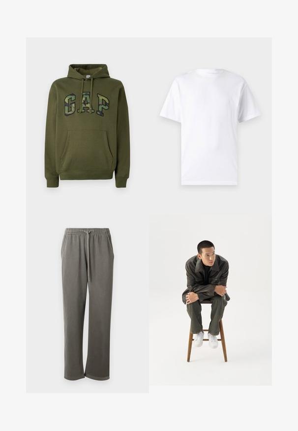 Olijfgroene hoodie met een voorste buidelzak, trekkoord capuchon en het "GAP" logo in camouflageprint over de borst.; Witte T-shirt met korte mouwen, gemaakt van katoen, met een ronde hals. Het heeft een gladde textuur en een eenvoudig ontwerp zonder patronen of accenten.; Grijze katoenen sweatpants met een elastische tailleband en trekkoord, met zijzakken en een ontspannen pasvorm langs de benen.; Jonge man in een donkere leren jas en spijkerbroek zit op een houten kruk, leunt naar voren met gekruiste armen en kijkt naar de zijkant tegen een witte achtergrond.