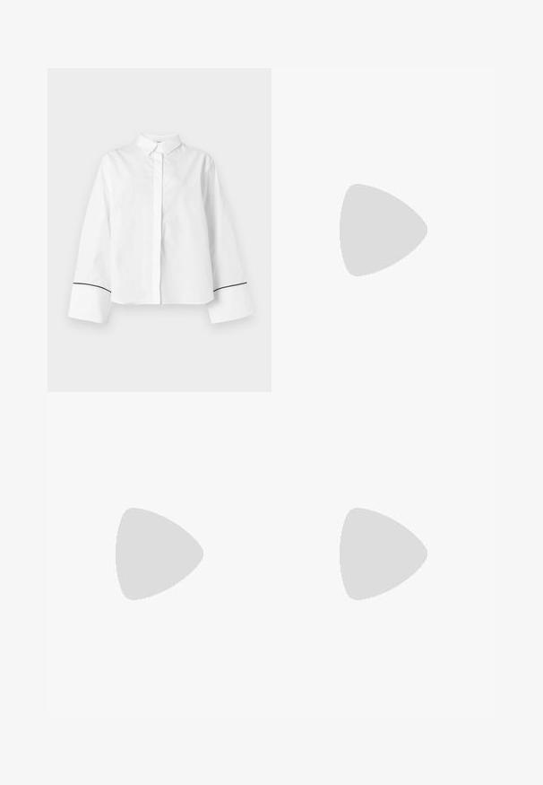 Chemise blanche à manches longues boutonnée, col pointu, larges poignets avec fine bordure noire près des extrémités, devant uni et coupe décontractée.; Jupe crayon en maille texturée crème avec une taille haute et un motif festonné subtil.; Sandale à talon haut noire avec une bride étroite à la cheville, bout carré, cuir lisse et accent de boucle métallique.; Pochette rectangulaire beige avec rabat pliant et fermoir barre verticale doré centré sur le devant.