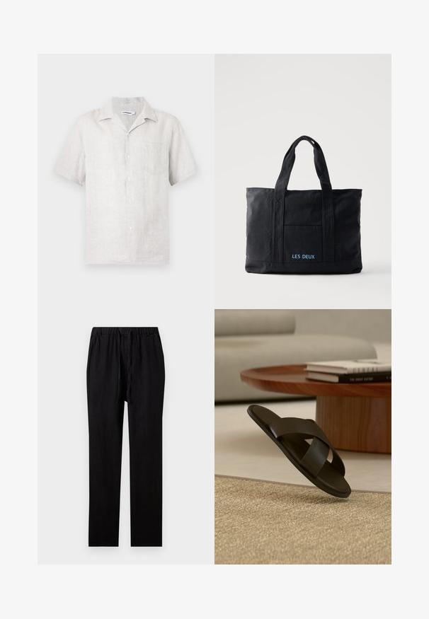 Chemise à manches courtes boutonnée en lin beige clair avec une poche poitrine gauche et un col classique.; Pantalon noir droit avec taille élastique et cordon, en tissu léger.; Sandale slide en cuir noir avec larges brides croisées sur un tapis beige, près d'une table basse ronde en bois avec des livres empilés.; Sac cabas en toile noire avec deux anses, poche avant et "LES DEUX" brodé en bleu sur la poche avant.