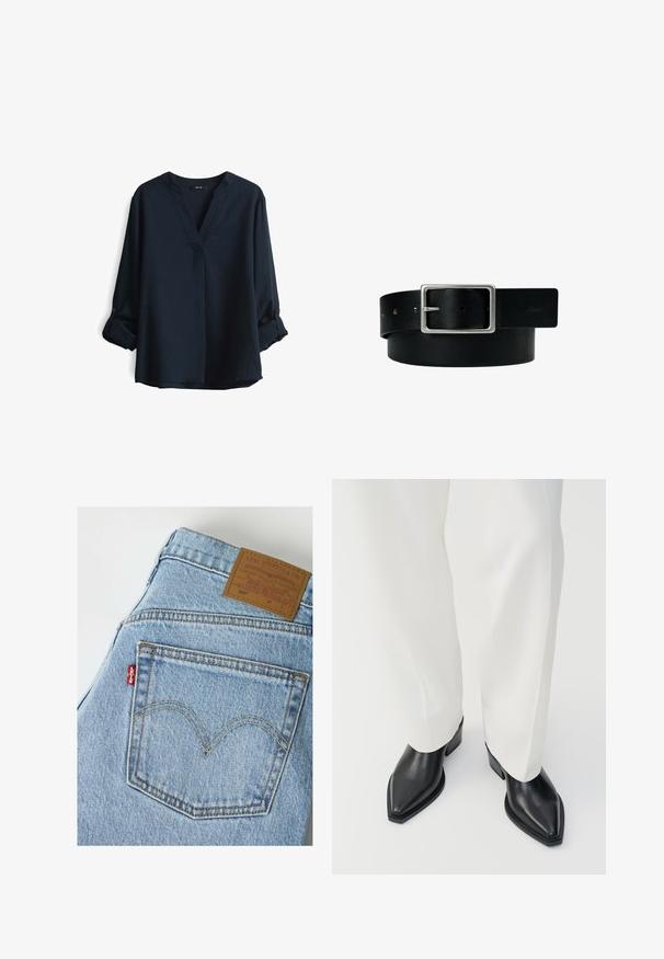 Navyblauwe blouse met lange mouwen, een V-hals en oprollende knopenmanchetten. Gemaakt van lichtgewicht stof met een relaxte pasvorm.; Lichtblauwe Levi's denim jeans met de achterzak met oranje stiksels en het bruine Levi Strauss merkje op de tailleband.; Zwarte puntige enkellaarzen met een gladde leren afwerking, lage blokhakken, gecombineerd met witte wijde broekspijpen. Eenvoudig en modern design.; Zwarte leren riem met zilveren rechthoekige gesp en meerdere verstelgaten, plat gelegd op een witte achtergrond.