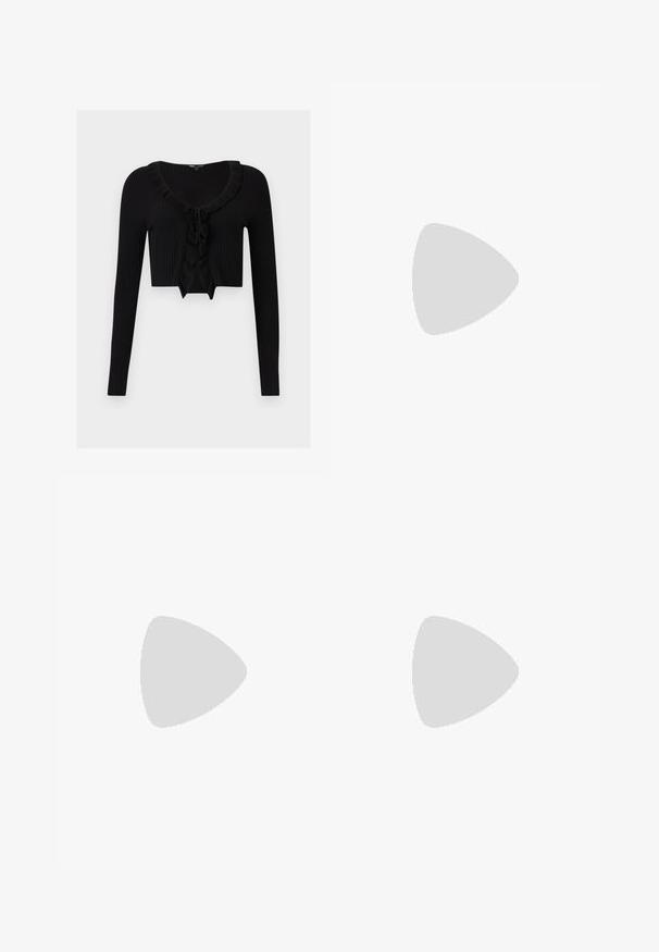 Cardigan court en maille côtelée noire avec manches longues, encolure volantée et détail noué devant.; Jupe noire asymétrique en tissu texturé avec un ourlet irrégulier, présentant un design drapé et superposé ainsi qu'un détail de lien sur un côté.; Jambes portant des leggings côtelés foncés associés à des ballerines noires avec de petits détails en nœud sur fond blanc.; Sac noir en matériau texturé et brillant avec une poignée circulaire torsadée et une fermeture éclair. Présente un design doux et froissé.