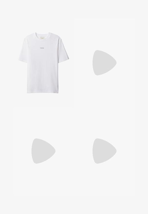 T-shirt blanc en coton avec un col rond et des manches courtes. Présente un petit logo noir "Calvin Klein" centré sur la poitrine.; Shorts en coton beige avec taille élastique, bouton avant et deux poches latérales. Présente des coutures discrètes et un petit logo sur le côté.; Baskets blanches Calvin Klein avec lacets, présentées en suspension au-dessus d'un sol en béton poli et d'un mur en blocs de verre en arrière-plan.; Sac cabas noir Calvin Klein avec deux longues poignées et une poche avant, avec le logo de la marque en blanc et gris.
