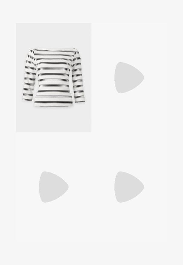 JJXX JXFIFI BOATNECK - T-shirt à manches longues - black; Jupe courte à motif pied-de-poule, avec un schéma de couleurs beige et noir, design ajusté et passants pour ceinture à la taille.; Jambes portant des leggings côtelés foncés associés à des ballerines noires avec de petits détails en nœud sur fond blanc.; Sac à main en cuir noir de forme rectangulaire, doté d'une seule ansse structurée, de quincaillerie argentée et d'une fermeture éclair. Texture lisse.