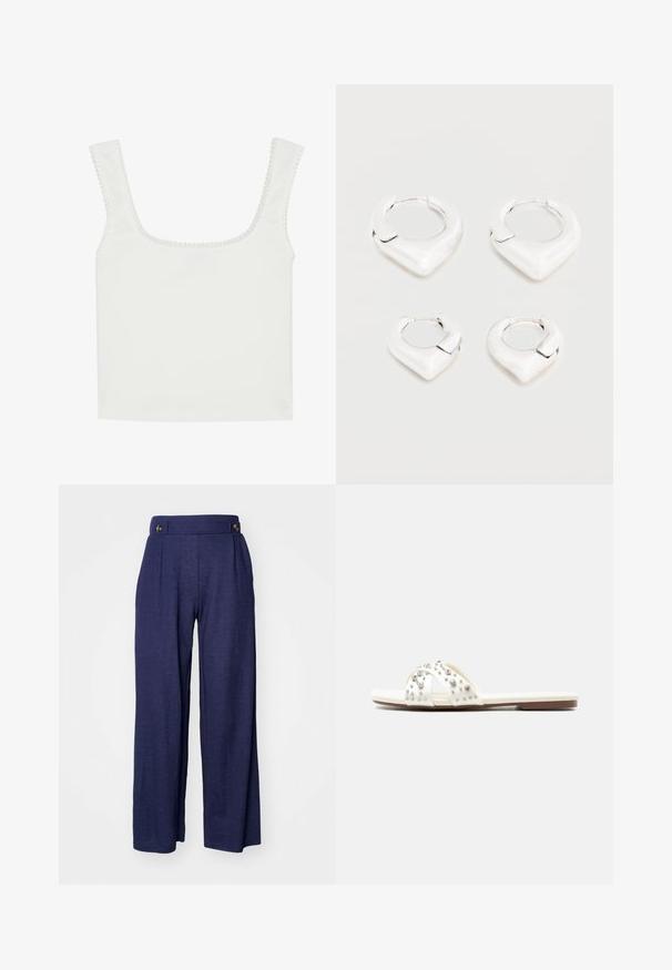 Witte geribde tanktop met een vierkante hals en brede bandjes. Voorzien van een golvende rand langs de halslijn en armsgaten.; Marineblauwe wijde broek gemaakt van een zachte stof, met plooien en twee voorknopen in de taille voor extra detail.; Witte platte slidesandal met kruisende bandjes, versierd met zilveren studs en strasssteentjes op een bruine zool tegen een witte achtergrond.; Twee paar glanzende zilveren oorbellen in de vorm van ringen met een kenmerkend puntig, V-vormig ontwerp, weergegeven op een witte achtergrond.