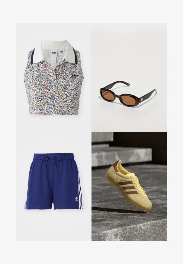 Blomstret cropped bluse med hvid bund og blomster i blå, rød og gul. Inkluderer en hvid krave med marineblå detaljer og et broderet logo.; Mørkeblå træningsshorts med snøre i taljen, præget af hvide sidelister og et broderet logo nederst til venstre. Blødt stof.; Gul Adidas Gazelle sneaker med brune striber og hældetalje, der svæver over en grå betongulv med trin i baggrunden.; Brune skildpadde-solbriller med ovale linser, der har en tynd stel og en lille metalaccent på siden. Struktureret og poleret overflade.