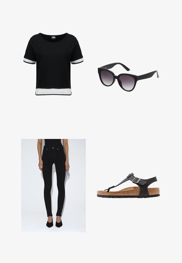 Schwarzes, kurzes T-Shirt mit kurzen Ärmeln, das weiße Mesh-Details an den Ärmeln und dem Saum aufweist. Glattes Material; runder Halsausschnitt.; Person trägt schwarze Skinny-Jeans mit hoher Taille und schwarze spitze Pumps, steht vor einem schlichten weißen Hintergrund.; Birkenstock KAIRO NU REGULAR - Riemensandalette - black; Schwarze Cat-Eye-Sonnenbrille mit grauen Verlaufslinsen. Dicke, glänzende Kunststoffrahmen und sich verjüngende Bügel. Keine sichtbaren Marken oder Verzierungen.