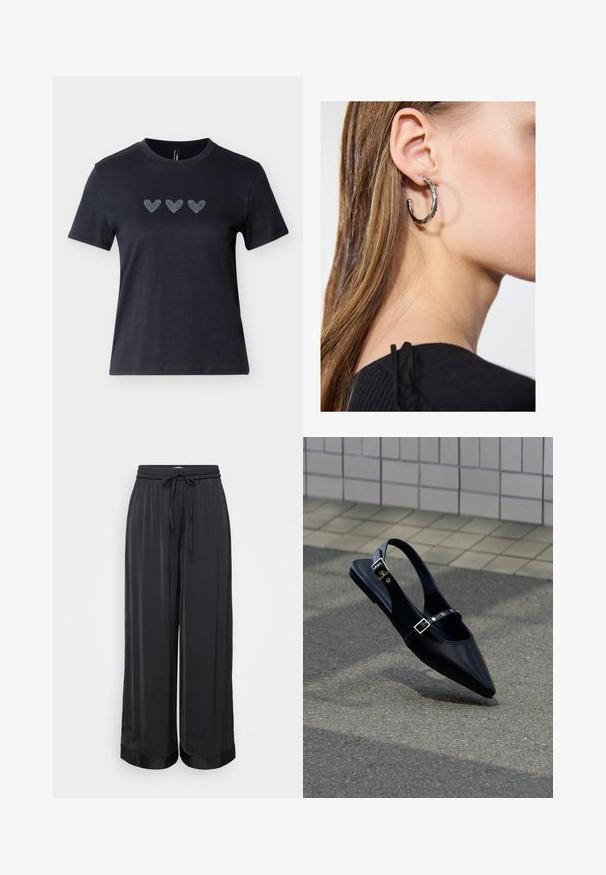 Camiseta negra de manga corta en algodón con tres diseños de corazones de pedrería en fila a lo largo del pecho, mostrando una textura suave.; Pantalones anchos negros hechos de una tela suave, con una cintura elástica y cordones, y una textura ligeramente brillante.; Zapato plano negro de punta puntiaguda con tiras de doble hebilla y talón descubierto, descansando sobre asfalto gris cerca de una pared con azulejos.; Pendiente de aro de plata con un acabado pulido, que presenta pequeños detalles en dorado y una forma redonda, llevado en el lóbulo.