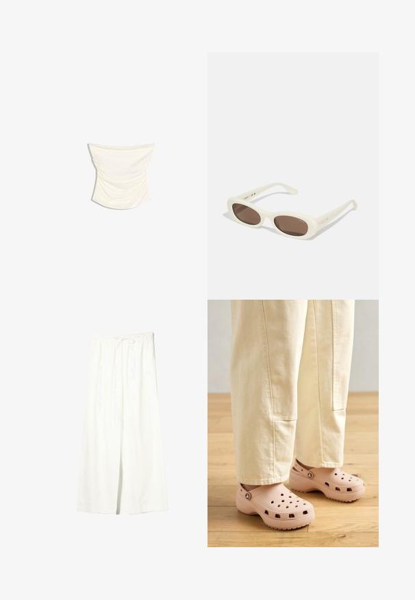 Crèmekleurige satijnen strapless top met geplooid ontwerp en licht gebogen zoom tegen een witte achtergrond.; Witte linnen broek met brede pijpen, elastische tailleband en trekkoord, voorzien van zijzakken en een voorste split.; Lichtroze klompen van rubber, met ventilatiegaten, een gevormde pasvorm en een geprofileerde zool voor grip. Draagt in combinatie met lichtbeige broek.; Crème-kleurige zonnebril met ovale lenzen, bruin getint, met een glanzende afwerking en subtiele "Vogue" branding aan de zijkant.