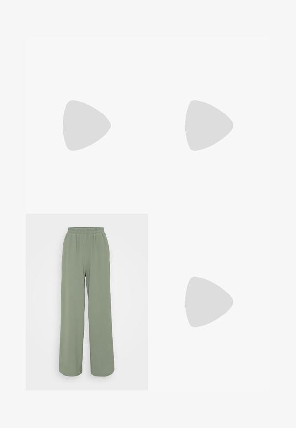 Camiseta negra sin mangas con encaje en el escote y en las tirantes; tejido suave con un diseño fluido para un ajuste relajado.; Pantalones de pierna ancha en verde claro, con cintura elástica, hechos de una tela texturizada. Presentan un suave drapeado y un ajuste relajado.; Un zapato mule blanco abierto en la punta con tacón ancho sobre suelo pavimentado cerca de una pared de azulejos, inclinado para mostrar vistas lateral y superior.; Bolso pequeño estilo bolso cubo hecho de cuentas brillantes de color crema con asa de cuentas en forma de lazo y cierre decorativo con nudo de cuentas.