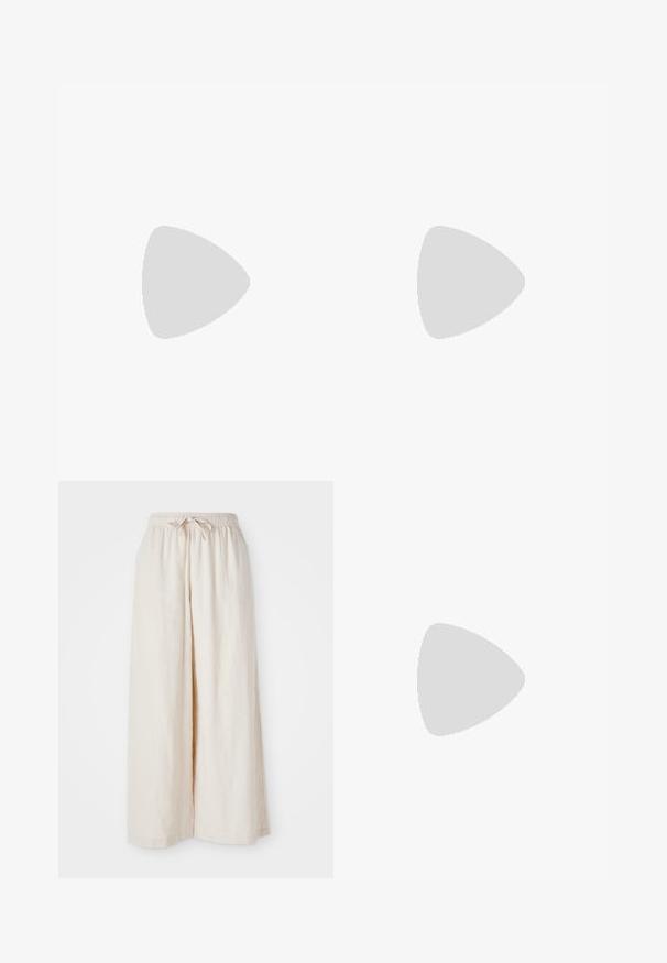 Top court rose fabriqué à partir d'un tissu texturé. Il présente un col rond et des emmanchures larges, avec un petit logo en accent au bas.; Pantalons larges de couleur crème avec une taille élastique et un cordon de serrage. Tissu en lin léger et lisse, sans motifs ni matériel visible.; Baskets blanches Adidas Samba avec des bandes noires et une semelle en gomme, flottant au-dessus de marches en béton gris texturé.; Sac d'épaule beige en forme de demi-lune avec une texture douce et rembourrée. Comprend une bandoulière réglable et une fermeture éclair sur le bord supérieur.
