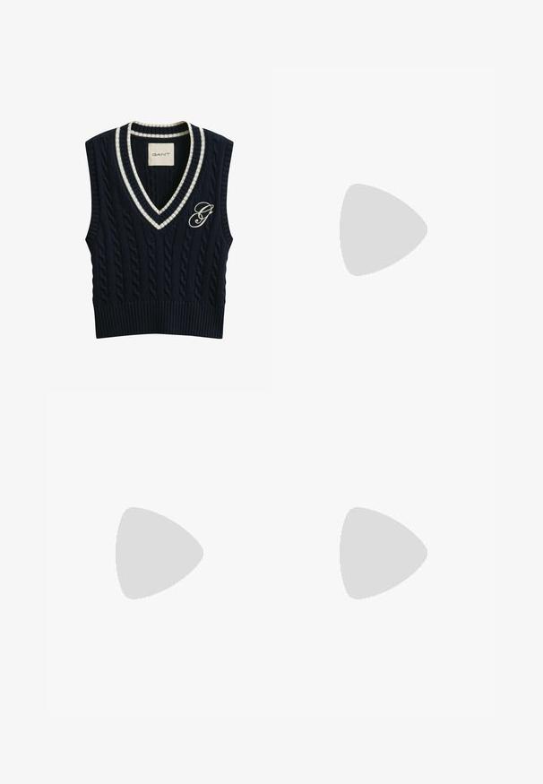 Gilet sans manches en tricot torsadé bleu marine avec encolure en V rayée blanche et logo "G" brodé sur le côté gauche de la poitrine.; Chemise blanche à manches longues, dotée d'un col structuré et d'un ourlet arrondi. Fabriquée à partir d'un tissu lisse et uni, sans motifs ni accents visibles.; Jupe à carreaux en gris et rose, présentant un design plissé avec des accents noirs et blancs. Fabriquée en tissu tissé, longueur mi-cuisse.; Mocassin penny en cuir marron foncé avec un petit talon empilé et une couture moc toe, vu de profil sur fond blanc.