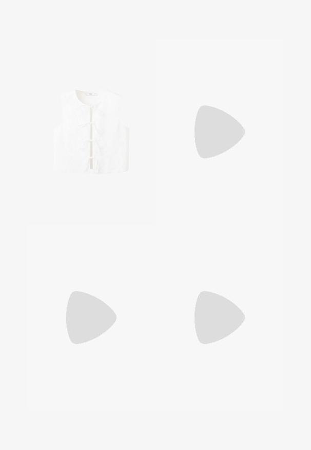 Blouse blanche sans manches avec broderie florale, encolure ronde et liens à l'avant pour la fermeture. Texture lisse avec une coupe décontractée.; Chemise blanche à manches longues boutonnée, avec un col pointe et de larges poignets, en tissu uni et lisse.; Jean blanc en coton à jambes larges, fermeture devant par bouton et zip, passants pour ceinture, style cinq poches.; Baskets blanches Adidas Samba avec des bandes noires et une semelle en gomme, flottant au-dessus de marches en béton gris texturé.
