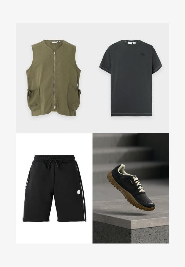 Chaleco sin mangas de color verde oliva con cremallera frontal y dos grandes bolsillos delanteros con cordones ajustables.; Camiseta de algodón gris oscuro con cuello redondo, mangas cortas y detalles de costuras blancas. Presenta un pequeño logo en el pecho.; Pantalones cortos negros hasta la rodilla con cintura elástica y cordón, rayas blancas verticales en los lados y pequeño logo redondo en el muslo izquierdo.; Zapato de senderismo negro y marrón con suela texturizada y cordones blancos suspendido sobre un borde de hormigón con escaleras desenfocadas al fondo.