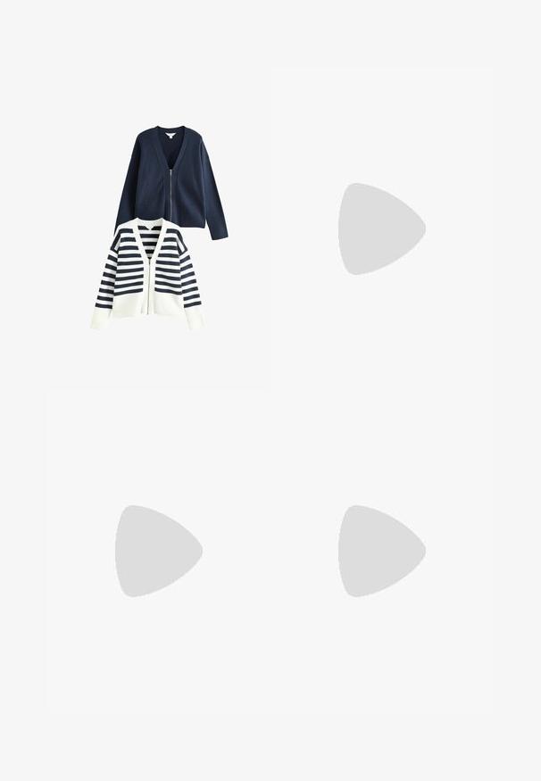 Cardigan blu navale con zip frontale e orlo a coste; cardigan a righe bianche e blu con un design simile. Entrambi presentano un collo a V.; Top bianco aderente realizzato in tessuto a coste, con maniche a farfalla e dettagli arricciati sui lati per texture e forma.; Pantaloni a gamba larga bianchi realizzati in un tessuto leggero. Presentano una vita elastica con cordoncino e tasche laterali. Texture liscia.; Sneakers in suede rosa chiaro con strisce e lacci bianchi, dotati di una linguetta testurizzata e di una suola in gomma, posizionati su un tappeto blu.