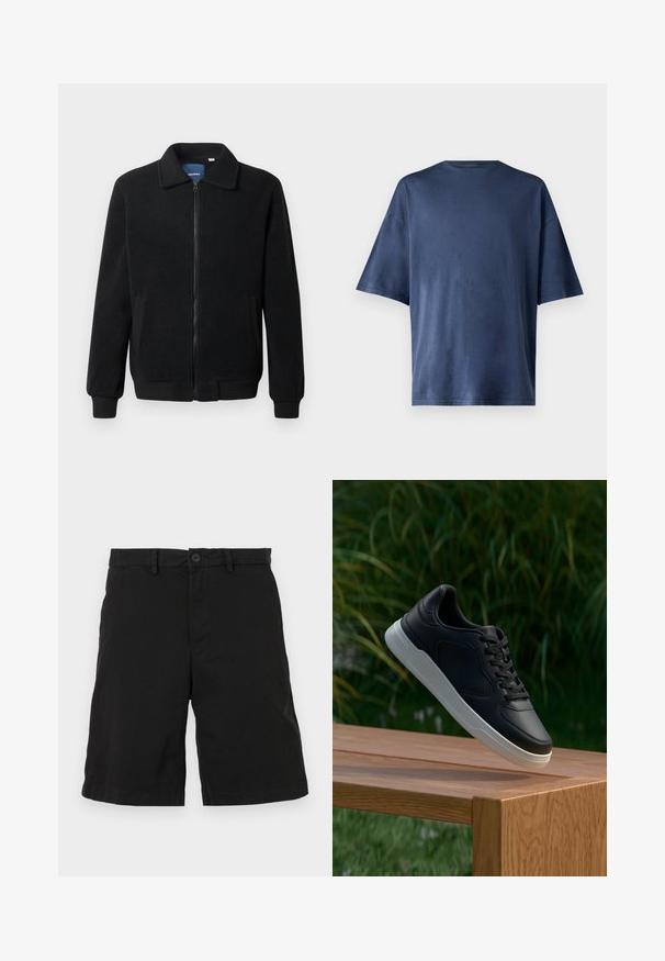 Musta fleece-takki, jossa on vetoketjulla suljettavat, pystykaulus, ribbireunat ja sivutaskut, joissa on teksturoitu pinta.; T-paita tummansinisestä pehmeästä kankaasta, lyhythihainen, klassinen pyöreä kaula-aukko ja rento istuvuus, ilman näkyviä kuvioita tai yksityiskohtia.; Mustat puuvillahousut, joissa on litteä etuosa, nappikiinnitys ja sivutaskut. Ei näkyviä kuvioita tai yksityiskohtia.; Musta lenkkari valkoisella pohjalla roikkuu puupenkillä, taustalla sumeaa vihreää kasvillisuutta.