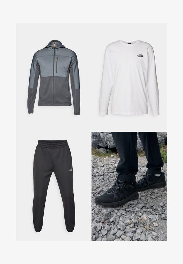 Šedá zipová bunda s kapucí a kontrastními texturovanými panely. Obsahuje náprsní kapsu a hladkou látku. Zapínání na předním zipu.; Bílý dlouhý rukáv tričko vyrobené z bavlny s kulatým výstřihem. Na hrudi se nachází malé černé logo. Hladká textura, běžný střih.; Černé tepláky s nastavitelným pasem, zúženým střihem, elastickými manžetami a malým bílým logem na levém stehně, vyrobené z hladké tkaniny.; Černé venkovní boty z prodyšného a syntetického materiálu, s texturovaným svrškem, bezpečným šněrovacím systémem a robustní podrážkou, na skalnatém terénu.