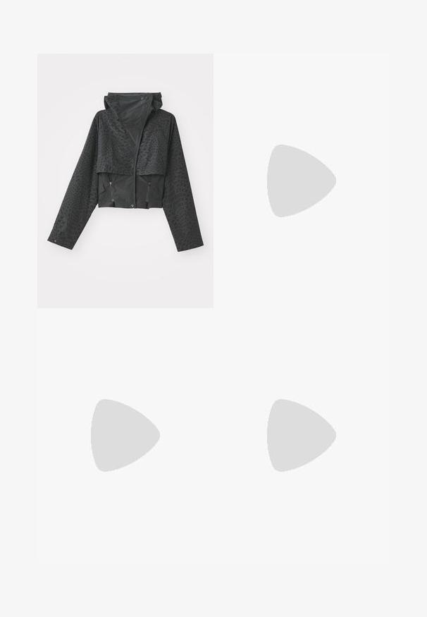 Sort cropped jakke med hætte, der har et struktureret geometrisk mønster, lange ærmer og lynlåslomme på siderne. Fremstillet af et let materiale.; Kortærmet hvid t-shirt med ribbet tekstur, gule flæser i kanten og blomsterbroderi centreret på brystet.; Grønne satin atletikbukser med en afslappet pasform, der har gule stribeaccenter og et broderet logo på venstre side. Elastisk talje.; Beige atletik sko med mesh og syntetiske overlejringer, med en tekstureret overflade, polstret krave og "ABZORB" dæmpning ved hælen.; Sorte metalrammesolbriller med mørke linser, katteøjeform og sorte templer med en regnbueaccent på den ene side.; Guldfarvede hoops øreringe, tynde og runde i formen, med en glat metallisk finish uden udsmykninger eller mønstre.