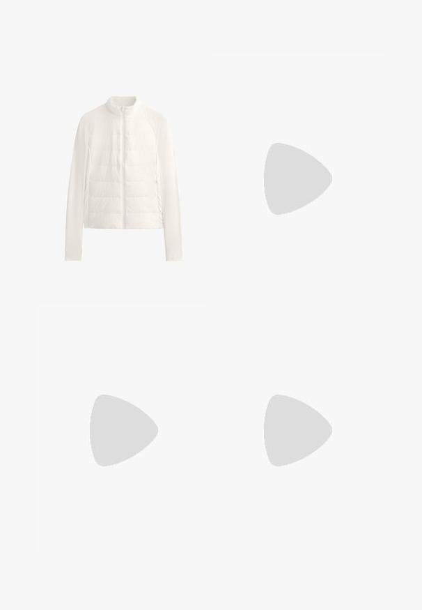 Giacca bianca leggera trapuntata con zip frontale completa, colletto rialzato, maniche lunghe e tasche laterali con zip.; Top a maniche corte bianco in cotone, con collo rotondo e un piccolo logo Under Armour nero sul petto.; Pantaloni neri a vita alta, a gamba affusolata, con cuciture diagonali frontali e dettagli di cucitura orizzontale vicino alla cintura su entrambi i lati.; Sneaker Adidas Gazelle con tomaia in suede crema, accenti in pelle blu, tre strisce blu, suola intermedia beige e suola in gomma marrone.