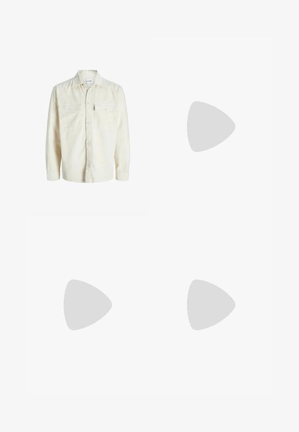 Off-white corduroy long-sleeve shirt with button front and two chest flap pockets with buttons.; White cotton t-shirt with short sleeves, featuring a front print that reads "Soar into Tranquility" in black and green.; Straight-leg blue denim jeans with five pockets and a button-zipper closure, displayed on a white background.; White sneakers with smooth texture, featuring brown leather accents and black detailing, paired with black tailored pants. Wooden floor background.