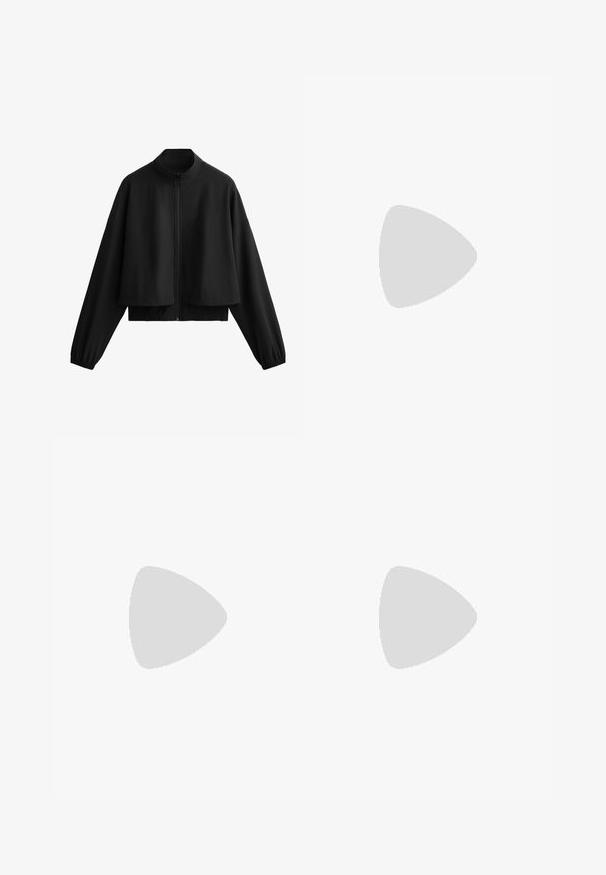 Černá zkrácená bunda s vysokým límcem, zipovým zapínáním, širokými rukávy a elastickými manžetami. Hladká textura, minimalistický design a žádné viditelné vzory.; Bílé bavlněné tričko, krátké rukávy, kulatý výstřih, uvolněný střih, hladká textura, bez vzorů nebo akcentů, jednoduchý design, univerzální styl.; Černé cyklistické šortky s vysokým pasem vyrobené z elastického materiálu, s úzkým střihem a délka do půli stehna, doplněné bílými sportovními botami a ponožkami.; Černé a šedé běžecké boty na traily s horní částí z prodyšné síťoviny, rychlým šněrovacím systémem a agresivním vzorkem podrážky. Mezi výrazné prvky patří logo Salomon a podrážka Contagrip.