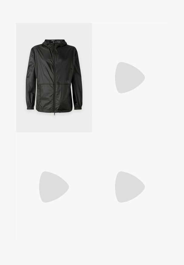 Black lightweight jacket with hood, featuring a full front zipper, elastic cuffs, and a smooth, shiny texture. Logo printed on the front.; Black cotton t-shirt with short sleeves, a crew neck, and a small logo tag on the front featuring care symbols in white.; Light blue denim jeans with a straight leg design, featuring a button fly, front pockets, and subtle fading on the thighs.; Black leather sneakers with white rubber soles, featuring round laces, smooth surface, and subtle branding on the heel. Worn with blue jeans.