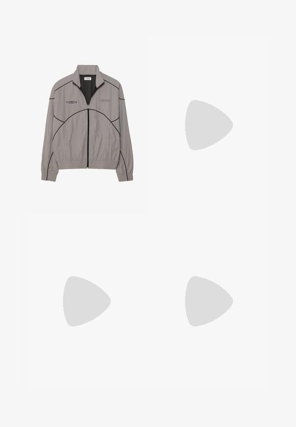 Light gray windbreaker jacket with black accent stitching, zip front, mesh lining, stand collar, and two side pockets. Brand logo on chest.; Set of three basic t-shirts in black, white, and light grey. Short sleeves, round neck, made from smooth cotton fabric. Brand logo visible.; Green cotton chinos with a straight silhouette, featuring belt loops, front pockets, and a button closure. Smooth texture with minimal stitching.; Black canvas sneakers with white rubber toe caps and laces. Contrast stitching and metal eyelets add detail. Worn with beige pants and black fabric.