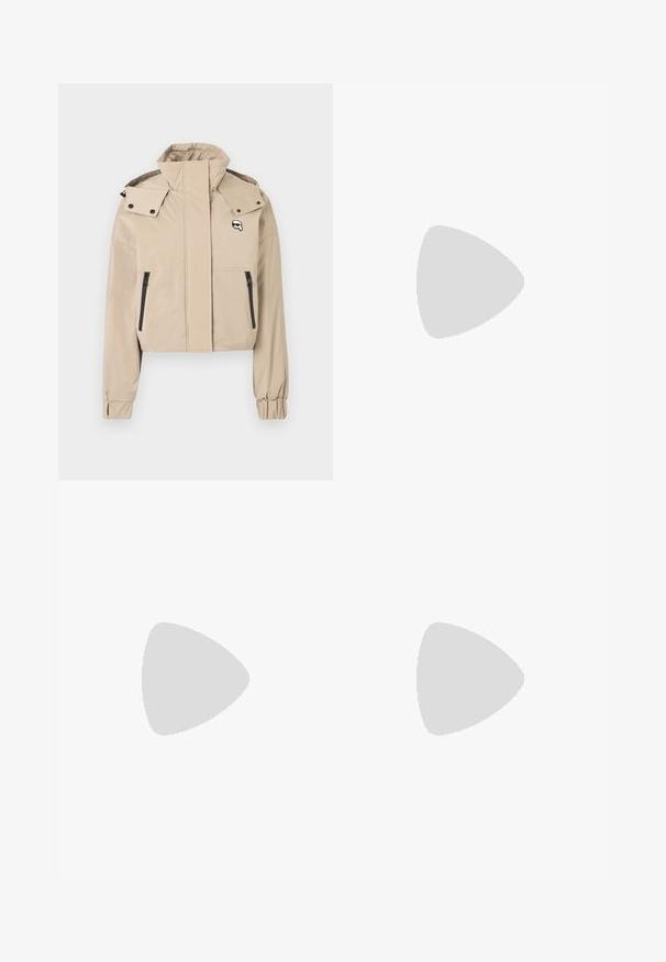 Cropped beige jacket with a high collar, snap button accents, and black zippered pockets on the front. Smooth fabric with elastic cuffs.; White short-sleeve t-shirt made of cotton with a crew neck design. Smooth texture and straight cut, no patterns or accents.; Tweed shorts in a neutral color with a black and white check pattern. Features decorative buttons on the front. Textured fabric.; Black heeled sandal with braided strap design, square toe, and adjustable ankle strap. Light beige footbed with a glossy black heel.