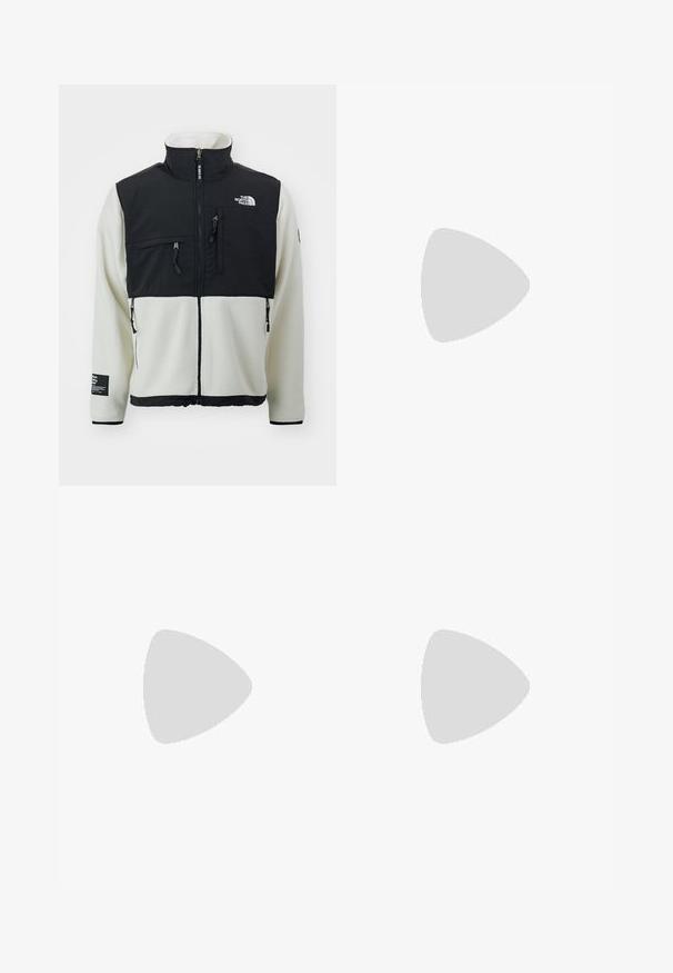 The North Face DENALI  mleczny; Czarna bawełniana koszulka z krótkim rękawem, okrągłym dekoltem i małym kolorowym logo na lewej piersi. Posiada prosty dół.; Czarne, szerokie spodnie wykonane z wytrzymałego materiału. Posiadają zapięcie na guzik i boczne kieszenie. Gładka tekstura z minimalistycznym designem.; Beżowe zamszowe sneakersy z zielonymi skórzanymi akcentami, zaokrąglony nos, białe sznurówki i fakturowane wykończenie po bokach. Widoczna gumowa podeszwa.