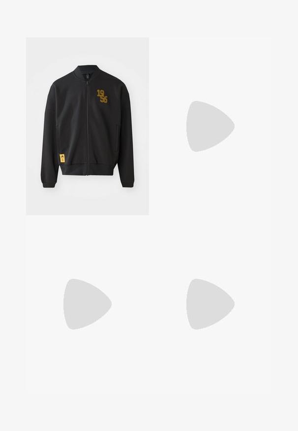 Black bomber jacket with a full zipper, ribbed collar and cuffs, yellow "1956" graphic on chest, and a yellow brand logo tag on the hem.; Three white ribbed tank tops made of cotton. Features a crew neck and small black labels near the hem. Available in multiple sizes.; Black denim wide-leg pants with a high waist, featuring five pockets and a button closure. Fabric has a smooth texture and slight stretch.; White leather sneakers with grey suede toe cap, three horizontal white stripes, blue accent, and brown rubber outsole. Textured detail on the sole.; Black oval sunglasses with dark lenses, thick frames, and silver dot accents on the sides. Smooth plastic material, contemporary design.