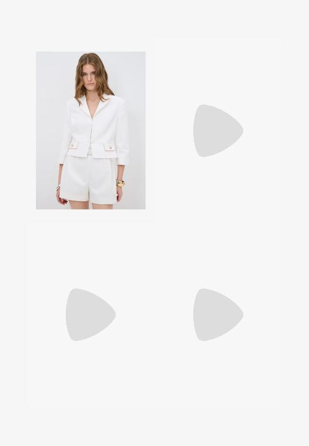 White tailored blazer with a fitted design, gold accents on pockets, and three-quarter sleeves. Paired with matching high-waisted shorts.; White ribbed tank top with lace trim on the neckline and sleeves. Features a soft texture and fitted shape. Brand label visible inside.; Wide-leg trousers in off-white fabric, featuring a high waist, double pleats, and a button closure. Smooth texture and tailored design.; White patent leather high-heeled shoe with a pointed toe and a smooth surface, featuring a slender heel and a low cut around the opening.
