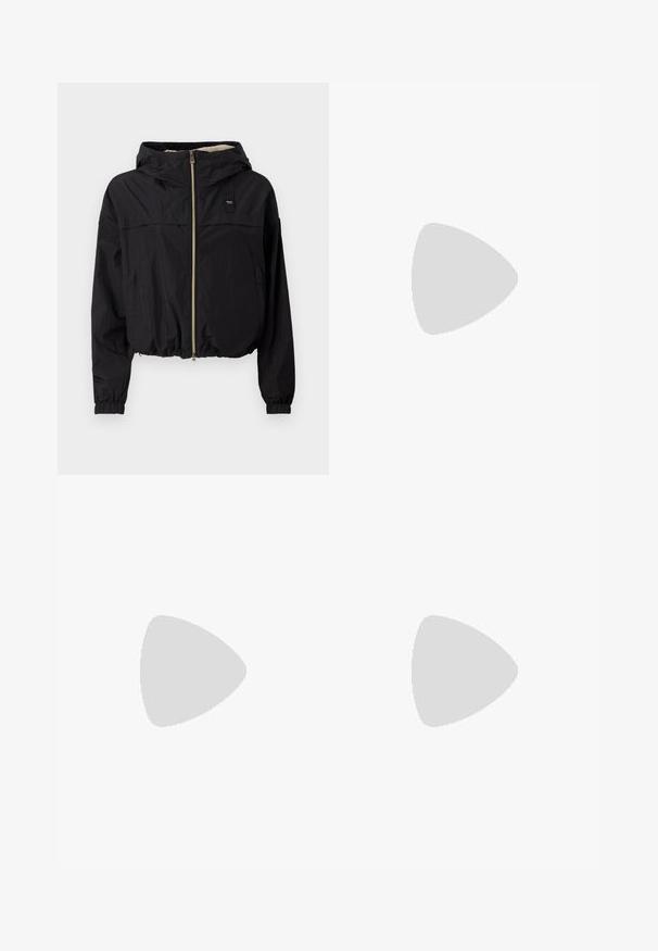 Black cropped jacket with a hood, featuring a front zip, elastic cuffs, and a textured lining visible at the collar. Minimalist design.; White cotton t-shirt with short sleeves, round neck, and a small green Lacoste logo on the left chest. Features a relaxed fit and smooth texture.; White sweatpants made of soft, knitted fabric. Elastic waistband and cuffs provide a relaxed fit. Minimalist design, no visible patterns or accents.; White sneakers with textured leather, featuring a platform sole, round toe, and lacing system; paired with light gray crew socks and a denim skirt.