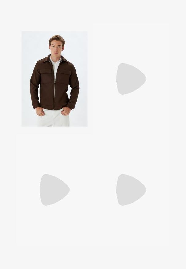Chaqueta marrón de canalé con cremallera frontal, dos bolsillos en el pecho y cuello. Combinada con pantalones blancos, que muestran una textura de tela y un corte a medida.; Camiseta gris de manga corta hecha de una tela suave y texturizada, que presenta un pequeño logotipo azul de Patagonia en el lado izquierdo del pecho. Sin patrones adicionales.; Jeans de mezclilla azul oscuro con un diseño de pierna recta, que presentan una cintura alta, bolsillos frontales y costuras amarillas en contraste.; Zapatilla de cuero blanca con un acabado suave, puntera redonda, cordones planos y suela texturizada. Cuenta con un sutil logo en el talón.