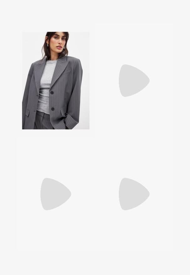 Pelēkas pinstrīpu žaketes ar apgrieztiem klaniem, divām melnām pogām un priekšējām kabatām, savienota ar pieguļošu pelēku apakšveļu ar round neck.; Melna topiņš ar vienu plecu, izgatavots no gludas auduma, ar pieguļošu siluetu un gludu, šūtu kakla izgriezumu. Nav redzamu rakstu vai akcentu.; Melni plaši bikses, izgatavotas no gludas, spīdīgas auduma, ar elastīgu jostu un bez redzamām kabatām vai aparatūras detaļām.; Melni kanvas sporta apavi ar baltām šņorēm, baltu gumijas purngalu un masīvu baltu zoli. Iezīmējas ar smalku baltu šuvumu un gumiju zoli.