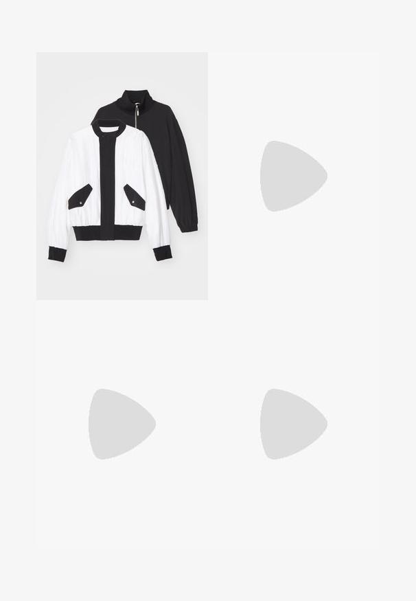 Chaqueta recortada en blanco y negro con un cuello negro con cremallera, dos bolsillos frontales con botones a presión y un dobladillo y puños acanalados.; Camiseta de algodón negra con cuello redondo, mangas cortas y una etiqueta blanca rectangular con números y un diseño gráfico.; Pantalones de pierna ancha negros hechos de un tejido suave. Cuentan con una cintura elástica, una textura suave y un diseño simple y moderno sin patrones.; Zapatilla deportiva blanca con un diseño elegante, que presenta una puntera de ante, paneles de cuero y acentos texturizados en contraste. Suela plana de goma.