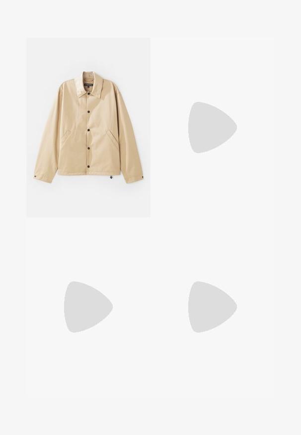 Tan lightweight jacket with a collared neck, snap-button closure, side pockets, and a smooth texture. Features a branded label inside.; White cotton t-shirt featuring a navy blue eagle graphic and "EMPORIO ARMANI" text below the design. Short sleeves and a crew neck.; Beige straight-leg pants with belt loops, front button, and zip closure, displayed flat on a white background.; Black suede sneaker with lace-up design and contrasting white rubber sole. Features textured side panels and subtle branding on the heel.