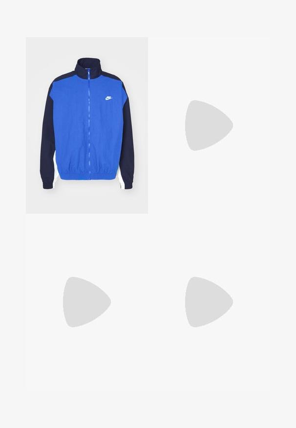 Blue and navy zip-up jacket with high collar, elasticated hem and cuffs, featuring a white Nike logo on the chest and striped sleeve accents.; White long-sleeved T-shirt made of cotton. Crew neck design with ribbed cuffs and a small logo on the left sleeve. Smooth texture.; Black shorts featuring a drawstring waistband, lightweight fabric with a smooth texture, and a simple design without visible logos or patterns.; Black athletic shoes with textured fabric and rubber soles, featuring elastic laces and a blue accent on the heel. Worn with light denim pants.