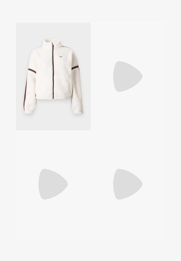 White fleece jacket with full front zipper, high collar, and brown stripes along sleeves and zipper line.; White cotton t-shirt featuring a graphic of feet in yellow Nike cleats with blue accents, paired with a bracelet on the left wrist.; Light beige pants with an elastic waistband, featuring pink side panels and side pockets. Smooth texture with a straight-leg design.; White Nike sneakers with red accents, paired with black pants featuring a floral pattern. Texture is smooth with a flat braid sole.