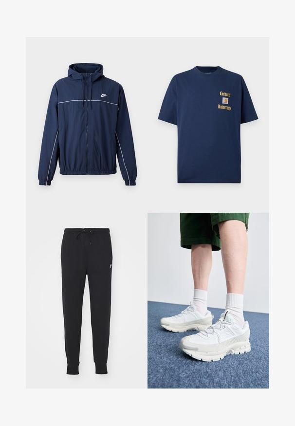 Giacca a cappuccio blu navy con striscia bianca di accento, chiusura con zip, polsini ed elastico in vita; presenta un piccolo logo Nike sul petto.; T-shirt in cotone blu navy con maniche corte, caratterizzato da testo dorato "Carhartt University" e un patch del logo sul lato sinistro del petto.; Pantaloni della tuta neri realizzati in cotone misto, con vita regolabile tramite cordino, gambe affusolate e un piccolo logo bianco sul davanti.; Scarpe da ginnastica bianche con sovrapposizioni testurizzate, suola spessa e accenti grigi. Indossate con calze corte bianche e pantaloni corti verdi su una superficie blu.