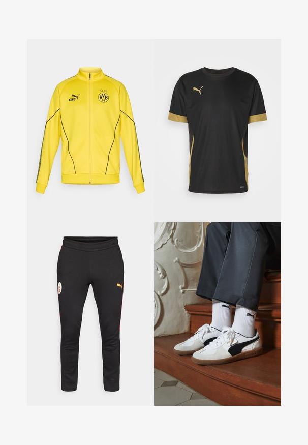 Giacca sportiva gialla con zip intera, logo Puma nero, testo "KING" ed emblema del club di calcio BVB 09 con due stelle sul petto.; T-shirt sportivo nero con dettagli dorati sulle maniche e sui fianchi. Presenta un colletto rotondo, maniche corte e tessuto traspirante DRYCELL.; Pantaloni tuta neri con accentuazioni laterali rosse, dotati di un patch logo bianco e un logo Puma giallo. Realizzati in un morbido tessuto elastico.; Sneakers Puma in suede bianco e nero, con suola in gomma marrone. Abbinati a calzini bianchi con logo nero, indossati con pantaloni scuri.