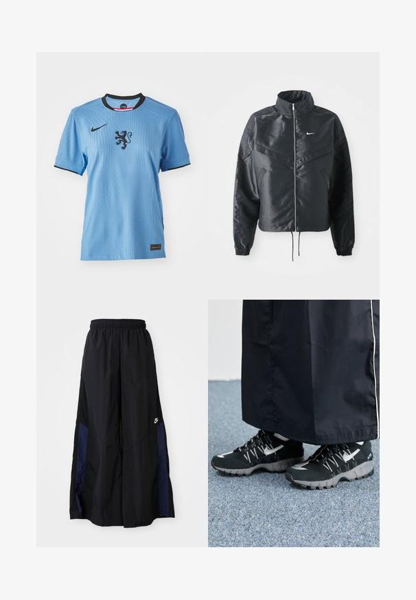 Casaco preto curto com colarinho alto, fecho de zip, punhos em elastano e um logótipo Nike branco. Tecido suave e brilhante com uma superfície ligeiramente texturizada.; Camisa da Nike de azul claro com mangas curtas, colarinho preto e um gráfico de leão no centro. Tecido texturizado com detalhes de nervuras subtis.; Calças largas pretas feitas de tecido leve, com um painel lateral azul-marinho e cintura elástica. Pequeno logótipo branco na parte inferior.; Tênis atléticos pretos com um cabedal texturizado, detalhes prateados e um solado estampado, combinados com uma peça longa preta. Ambientado sobre um tapete azul.