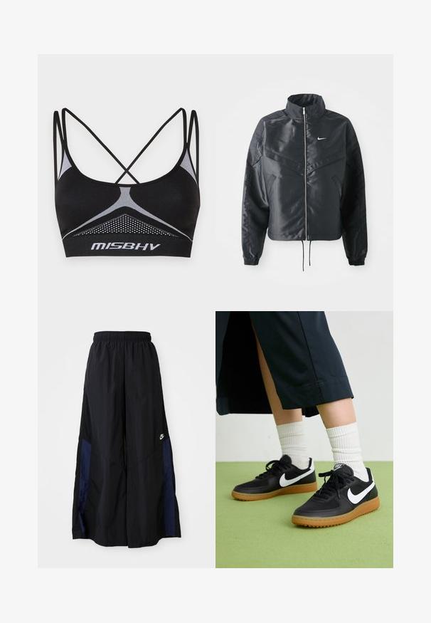 Zwarte cropped jack met hoge kraag, ritsluiting, elastische manchetten en een wit Nike-logo. Glad, glanzend materiaal met een licht gestructureerd oppervlak.; Zwarte sportbeha met gekruiste banden, voorzien van een textuur-mesh paneel en witte accentlijnen. Logo weergegeven op de band.; Zwarte wijdlopende broek van lichtgewicht stof, met een marineblauwe zijpaneel en een elastische tailleband. Klein wit logo onderaan.; Zwarte leren en synthetische sneakers met witte Nike swoosh, rubberen gumzool, ronde neus en zwarte veters. Geribbelde witte sokken zichtbaar.