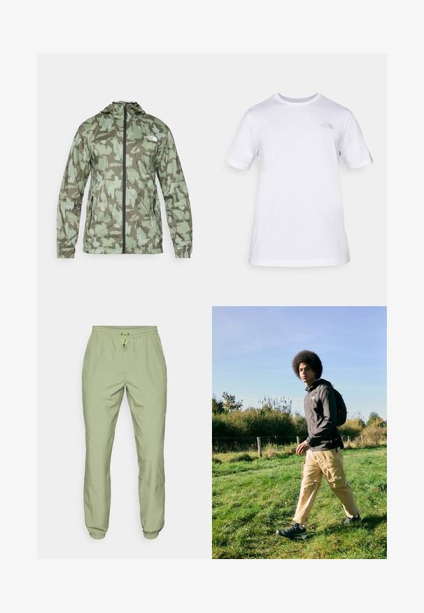 The North Face MOUNTAIN ATHLETICS - Vetrovka - new taupe/green; Biela bavlnená tričko s krátkymi rukávmi a okrúhlym výstrihom. Na ľavej strane hrudi sa nachádza malé šedé logo. Hladká textúra, štandardný strih.; Svetlozelené športové nohavice s elastickým pásom, sťahovacou šnúrkou a manžetami na členkoch; majú dve bočné vrecká a hladký povrch.; Čierna kapucňová bunda, béžové cargo nohavice s vreckami a čierne turistické topánky. Chodenie po tráve na dennom svetle, s pozadím porastu.