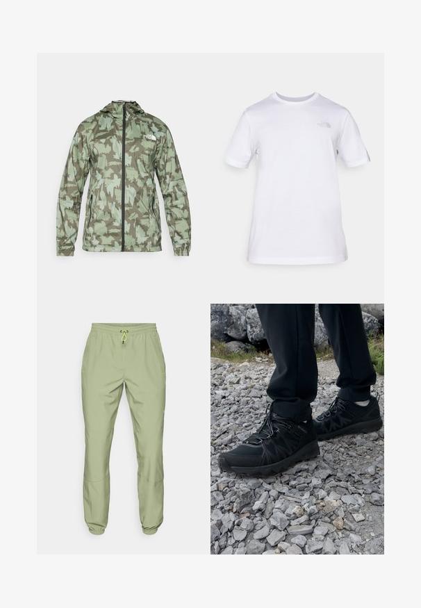 The North Face MOUNTAIN ATHLETICS - Vjetrovka - new taupe/green; Bijela pamučna majica kratkih rukava s okruglim izrezom. Ima mali sivi logo na lijevoj strani prsnog koša. Glatka tekstura, standardni kroj.; Svijetlozelene atletske hlače s elastičnim pojasom, zatvaranjem na vezicu i manžetama na gležnjevima; imaju dvije bočne džepove i glatku teksturu.; Crne vanjske cipele s mrežastim i sintetičkim materijalom, s teksturiranim gornjim dijelom, osiguranim sustavom vezanja i čvrstim potplatom, na stjenovitom terenu.