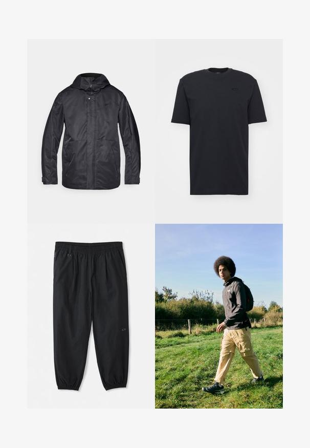 Svart vattentät jacka med huva, två framfickor, dragkedjestängning och en mjuk textur. Har en diskret logotyp på bröstet.; Svart bomullst-shirt med kort ärm och rund halsringning, med en diskret logotypaccent på bröstet och en avslappnad passform.; Svarta avslappnade byxor med elastisk midja, sidofickor, elastiska muddar vid anklarna och en liten logotyp på höger lår.; Svart, huvan jacka, beige cargobyxor med fickor och svarta vandringsskor. Går på gräs i dagsljus, med en bakgrund av lövverk.