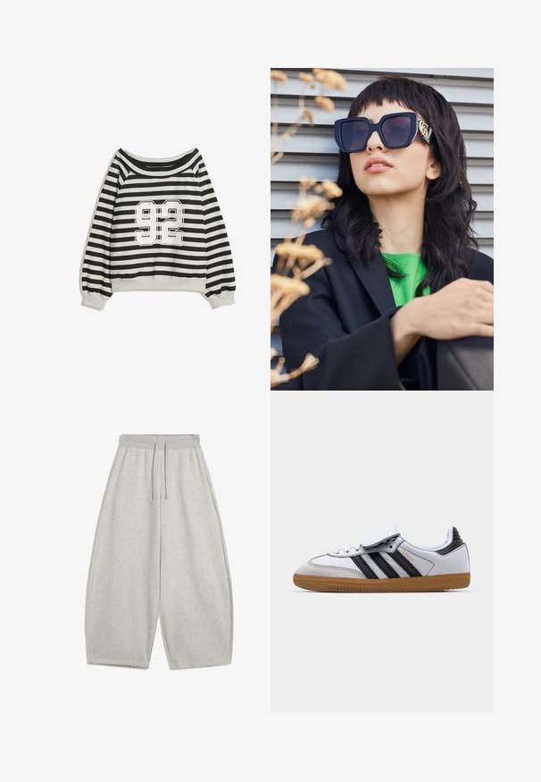 Jachetă din blană artificială neagră, cu fermoar frontal, glugă și buzunare laterale. Prezintă o textură netedă și o croială lejeră pentru confort.; Hanorac cu dungi în negru și gri, având un design off-the-shoulder și un imprimeu prominent alb "92" pe față. Textură moale, cu mâneci mansetă.; Pantaloni de trening largi, de culoare gri deschis, cu talie elastică și șnur, având buzunare laterale și o croială relaxată.; Adidași din piele albă cu dungi negre și accente gri, având vârful rotund și talpa din cauciuc natural. Curea cu Velcro și închidere cu șiret.; Ochelari de soare supra-dimensionați, de culoare neagră, cu un cadru gros și accente aurii, purtați cu un sacou negru și o cămașă verde aprins, pe un fundal orizontal.