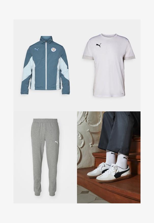 Vetrovka v temno teal in svetlo modri barvi, z zadrgo spredaj, visokim ovratnikom in logotipom Manchester City na prsih.; Bela športna majica s kratkimi rokavi in okroglim izrezom, ki vključuje zračne mrežaste dodatke na straneh ter črni Puma logo na prsih.; Sive trenirke iz mehkega blaga, z elastičnim pasom, zoženimi nogami in belim logotipom na levem stegnu.; Puma superge v beli in črni usnjeni izvedbi, sročene s rjavim gumijastim podplatom. Usklajene z belimi nogavicami z črnim logotipom, nosijo se s temnimi hlačami.