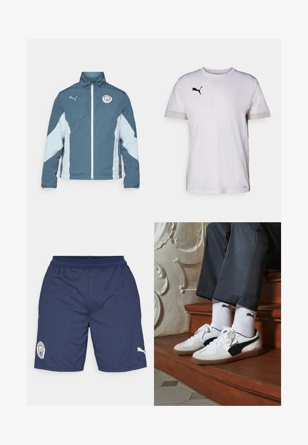 Kurtka typu windbreaker w ciemnym odcieniu teal i jasnym niebieskim, posiadająca zamek z przodu, wysoki kołnierz oraz logo Manchester City na piersi.; Biała koszulka sportowa z krótkim rękawem i okrągłym dekoltem, z oddychającymi wstawkami z siateczki po bokach oraz czarnym logo Pumy na piersi.; Granatowe szorty sportowe wykonane z poliestru, z łatą logo na lewym nogawce i białym akcentem Puma po prawej stronie. Zawierają elastyczny pas.; Sneakers Puma w białym i czarnym zamszu, z brązową gumową podeszwą. W połączeniu z białymi skarpetkami z czarnym logo, noszone z ciemnymi spodniami.