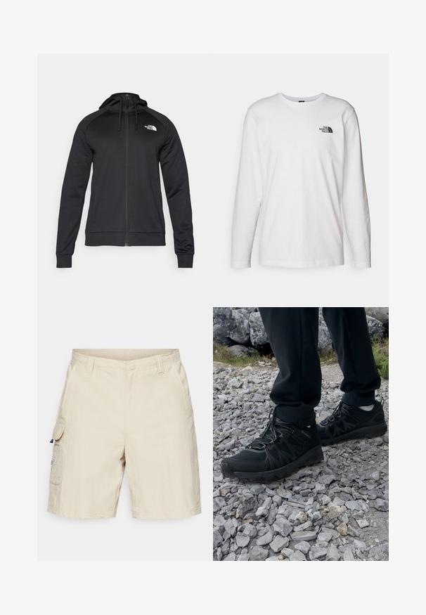 Czarny zamykany na zamek dres z dopasowanym krojem, z kapturem na sznurku i logo na lewej piersi. Miękka, elastyczna tkanina z prążkowanymi mankietami.; Biała koszulka z długim rękawem wykonana z bawełny, z okrągłym dekoltem. Posiada małe czarne logo na piersi. Gładka faktura, regularny krój.; Beżowe szorty cargo z bocznymi kieszeniami, zapięciem na guzik i fakturowanym materiałem. Na lewej kieszeni znajduje się mała metka.; Czarne buty outdoorowe wykonane z siateczki i materiału syntetycznego, z fakturowaną cholewką, zabezpieczonym systemem sznurowania i solidną podeszwą, na skalistym terenie.